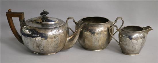 A 19th century matched silver three piece tea set including teapot by John Emes, gross 34 oz.